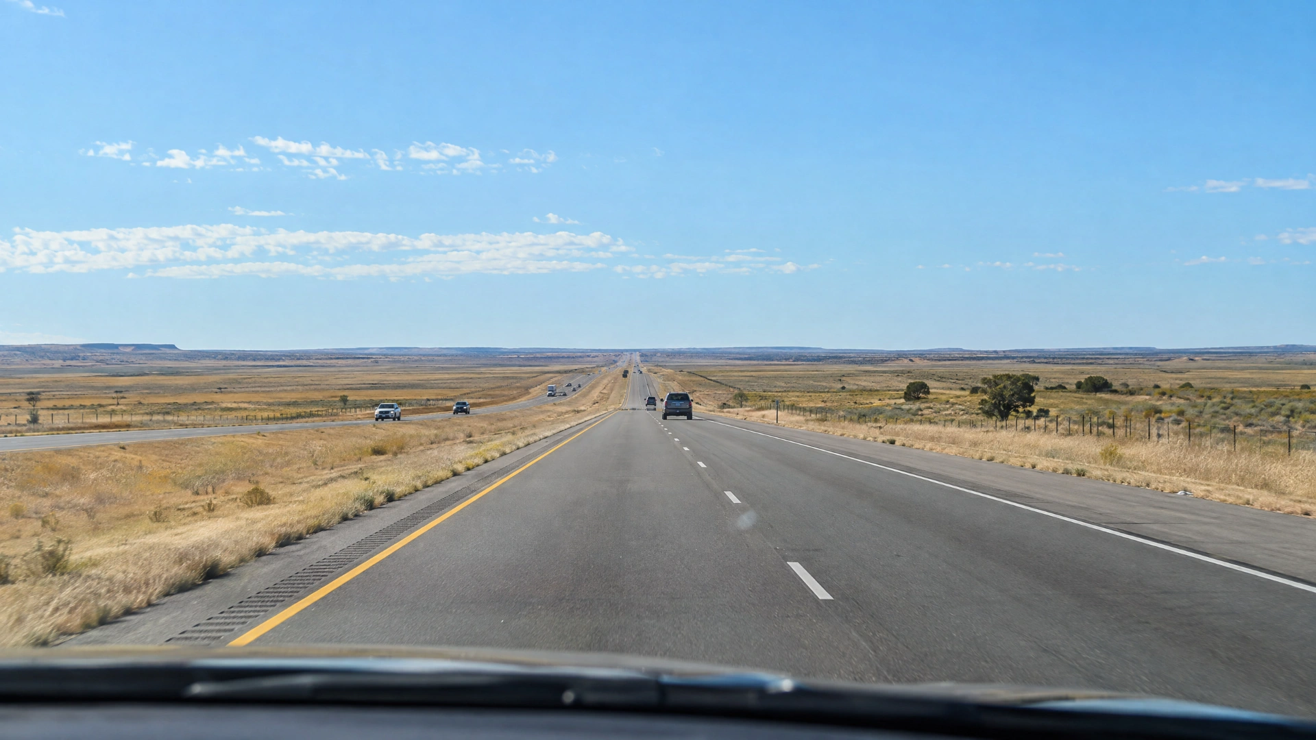 A northbound interstate crossing the open Texas Panhandle beneath a wide sky